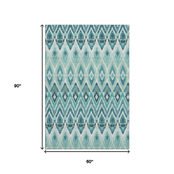 5' X 8' Teal White And Gray Southwestern Washable Area Rug With UV Protection