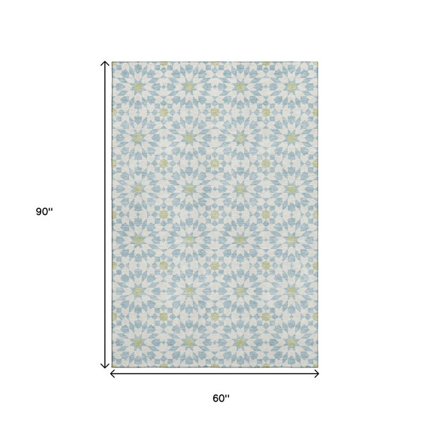 5' X 8' Sky Blue Ivory And Green Geometric Washable Area Rug With UV Protection
