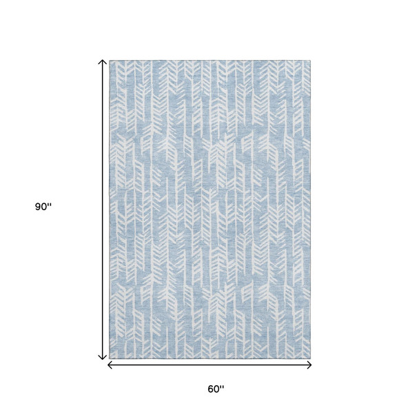 5' X 8' Sky Blue And Ivory Tribal Washable Area Rug With UV Protection
