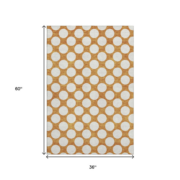 3' X 5' Orange And Ivory Polka Dot Washable Area Rug With UV Protection
