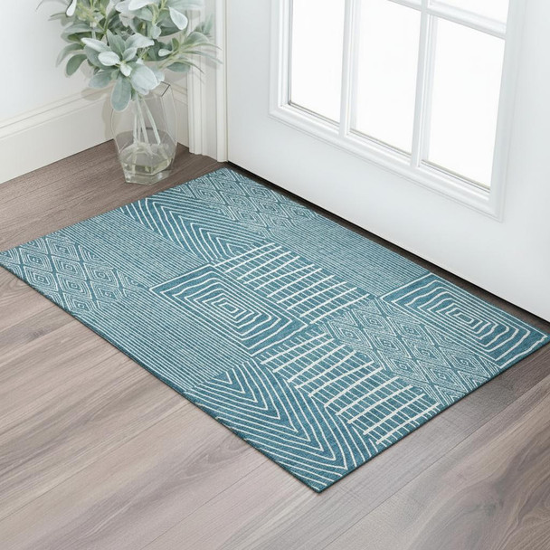 3' X 5' Teal And Ivory Geometric Washable Area Rug With UV Protection