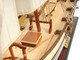 27" Brown And White Solid Wood Hand Painted Model Boat Tabletop Sculpture