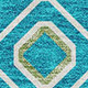 10' X 14' Teal Gold And Green Southwestern Washable Area Rug With UV Protection