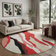 8' Red Black And Ivory Abstract Washable Round Rug With UV Protection