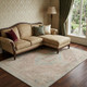 9' X 12' Pink Beige And Teal Tribal Washable Area Rug With UV Protection