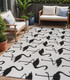 5' X 8' White And Black Animal Print Indoor Outdoor Area Rug