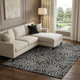10' X 14' Black And Ivory Abstract Washable Area Rug With UV Protection