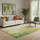 5' X 8' Green Gold And Orange Abstract Washable Area Rug With UV Protection