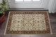 3' X 5' Ivory Red Green Grey Blue And Navy Oriental Power Loom Stain Resistant Area Rug With Fringe