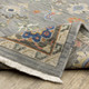 3' X 5' Blue Grey Gold Green Pink Orange Ivory And Red Oriental Power Loom Stain Resistant Area Rug With Fringe