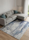 10' X 13' Ivory Blue And Black Abstract Power Loom Distressed Area Rug