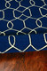 5' X 7' Navy Blue And Ivory Geometric Hand Hooked Area Rug