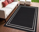 4' X 6' Black And Ivory Indoor Outdoor Area Rug