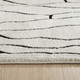 8' X 11' Cream and Black Abstract Distressed Area Rug