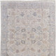 2' X 3' Ivory Tan and Blue Floral Hand Woven Distressed Area Rug With Fringe