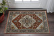 2' X 3' Blue Beige Grey Gold Green And Rust Red Oriental Power Loom Stain Resistant Area Rug With Fringe