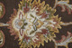 5' X 8' Brown Tan And Ivory Oriental Hand Tufted Area Rug