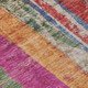 8' Beige Orange And Fern Green Round Striped Washable Indoor Outdoor Area Rug