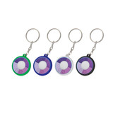 Four circular UV Checker keychains in green, purple, white, and black, each with a keyring attachment.