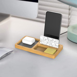 A bamboo pen holder and mobile stand featuring a marble accent, with compartments for a phone and accessories.