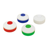 A set of four pill boxes in red, blue, green, and white, each with a circular design and a matching coloured top.