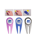 A selection of golf tees in pink, blue, and silver, each featuring a logo at the top.