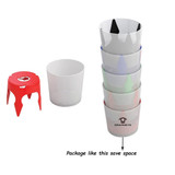A set of colourful plastic cups stacked together with a matching bottle opener in red. The cups feature various patterns.