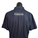 Image of a navy polo with the Australian College of Nursing Foundation logo printed on the back.