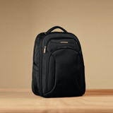 A black Samsonite Xenon 3.0 backpack with multiple compartments and a carrying handle. It features a logo.