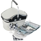 A grey and black picnic carry bag with cutlery, plates, glasses, napkins, and salt and pepper shakers arranged beside it. A grey and black picnic carry bag with cutlery, plates, glasses, napkins, and salt and pepper shakers arranged beside it.