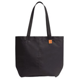A black tote bag with two shoulder straps and a subtle logo tag. Features a spacious, structured design.