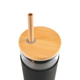 A glass tumbler with a black body, bamboo lid, and a bamboo straw. It features a circular opening for the straw. A glass tumbler with a black body, bamboo lid, and a bamboo straw. It features a circular opening for the straw.