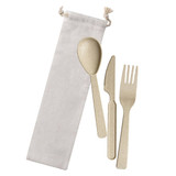 Wheat straw cutlery set including a spoon, fork, and knife in a cream fabric bag.