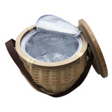 A round wicker picnic cooler basket with a wooden lid and a brown strap, featuring a silver insulated interior. A round wicker picnic cooler basket with a wooden lid and a brown strap, featuring a silver insulated interior.