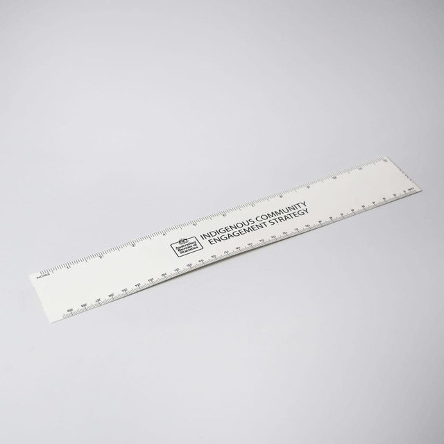 A white ruler with markings and a logo, designed for office and business use.