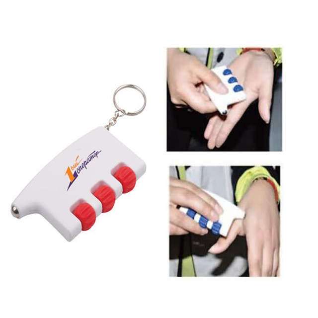 A health massager in white and red, featuring three blue buttons, attached to a keyring for easy carrying.
