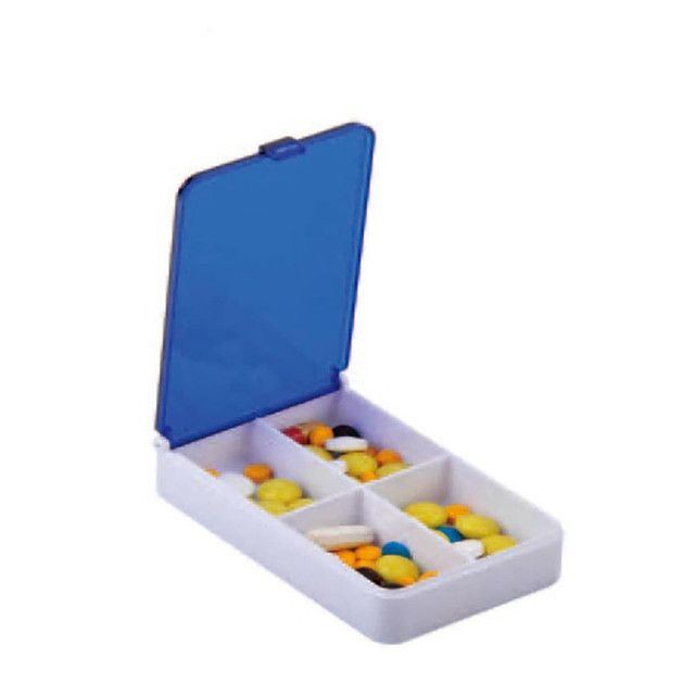 A pill box with a blue lid, containing various multicoloured pills and separated compartments.