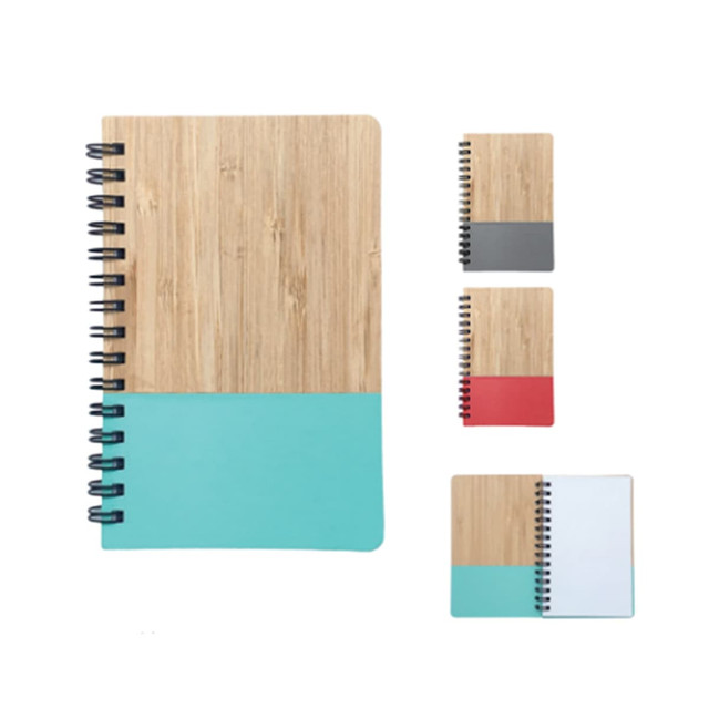A6 Notebook with a bamboo cover and coloured lower half in turquoise, grey, and red options. Features a spiral binding.