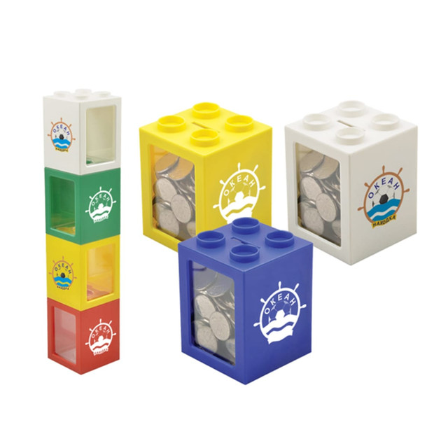 A set of four colourful coin banks: green, yellow, blue, and white, each with a logo and filled with coins.
