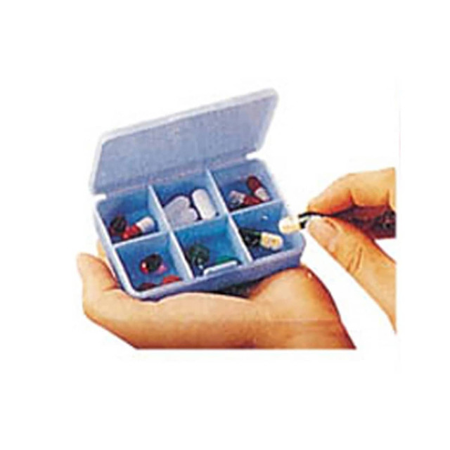 A light blue pill box with six compartments, containing various pills and capsules, held in two hands.