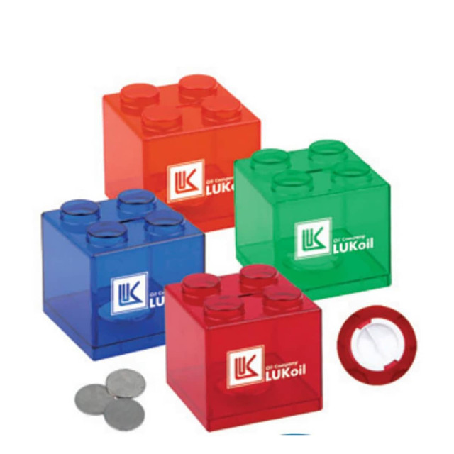 A set of transparent money boxes in red, blue, green, and clear, featuring logos and coin slots.