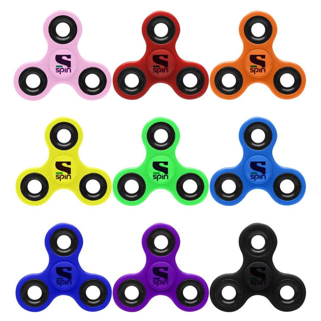 A grid of fidget spinners in various colours: pink, orange, yellow, green, blue, purple, and black, featuring a logo.