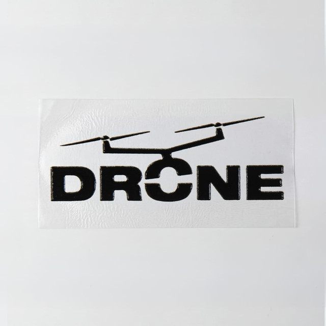 A 40 x 20mm sticker featuring a black drone graphic and the word "DRONE" on a white background.