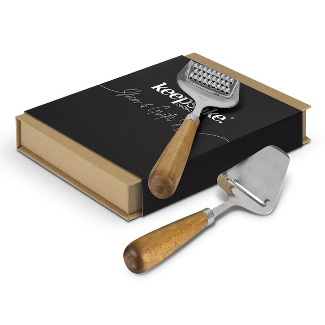 A slicer and grater set with wooden handles and a black presentation box featuring a logo. A slicer and grater set with wooden handles and a black presentation box featuring a logo.