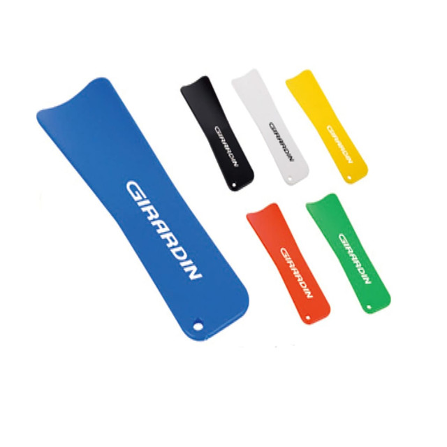 A collection of shoe horns in blue, black, white, yellow, red, and green, with a logo on each one. A collection of shoe horns in blue, black, white, yellow, red, and green, with a logo on each one.