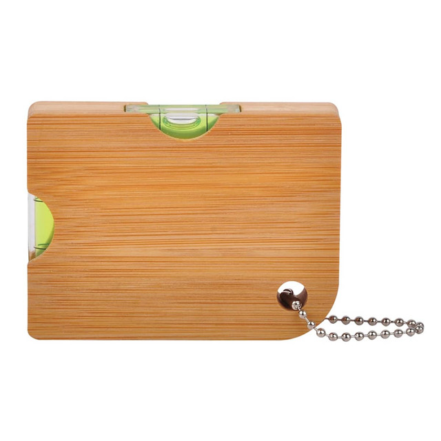 A drink bottle opener with a bamboo exterior, featuring a green gradienter and attached keyring chain.