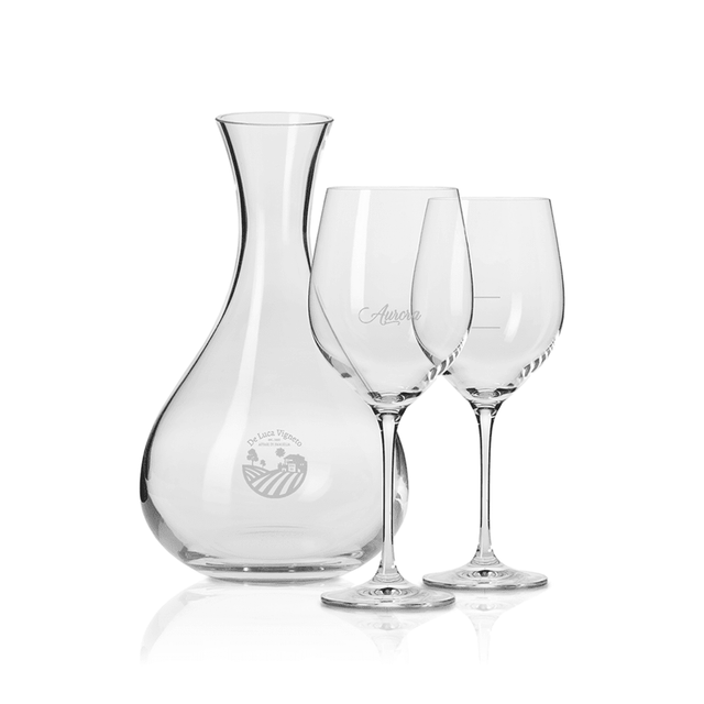 A glass wine decanter and two matching wine glasses, all crystal clear and elegantly designed, presented in a gift box.