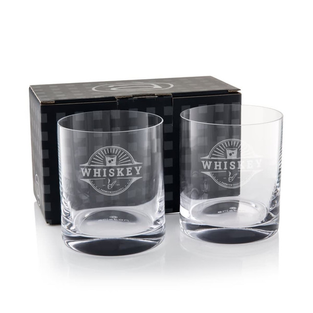 Two clear glass whisky tumblers packaged in a black box featuring a logo.