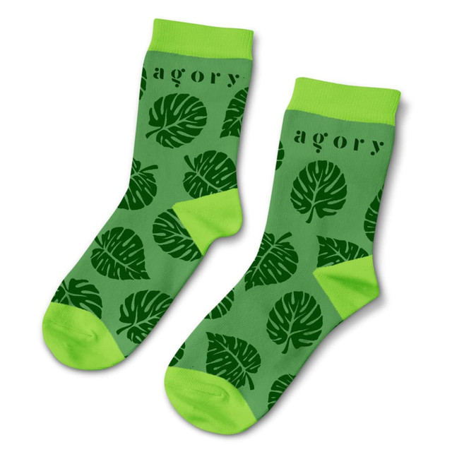 Green quarter socks featuring a leaf pattern in dark green with a bright green cuff. The socks have a logo. Green quarter socks featuring a leaf pattern in dark green with a bright green cuff. The socks have a logo.