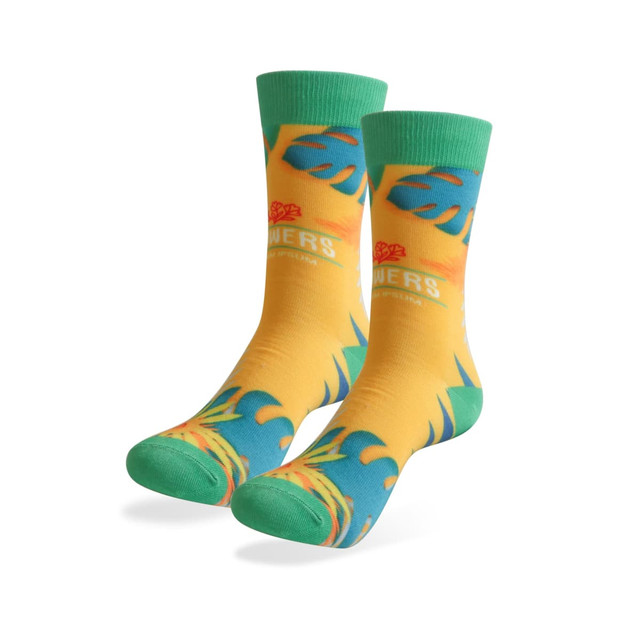 Vibrant yellow socks with green accents, featuring a tropical design and a logo. Ideal for casual wear.